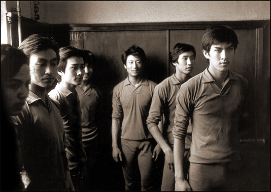 Male Chinese students waiting to participate in dance demonstration, 1980 Beijing Academy of Dance Arts